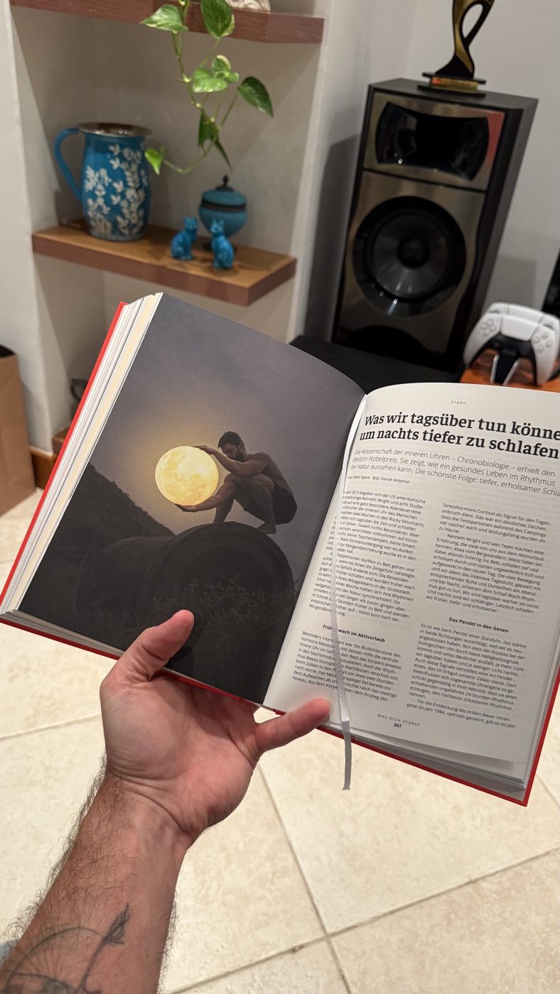Sanitas Health Forecast 2026 book open at page 267, with a full-page Moon photograph by Daniel Antoniol beside the story